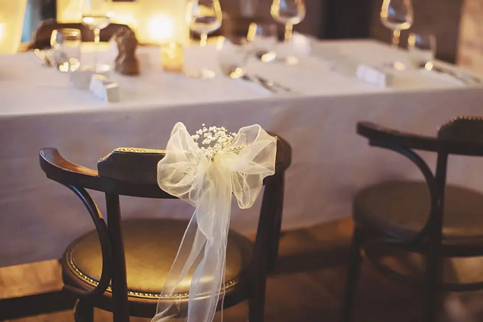 A chair with wedding ribbon and bow on with Ponti's Italian Kitchen, Fox Valley Sheffield